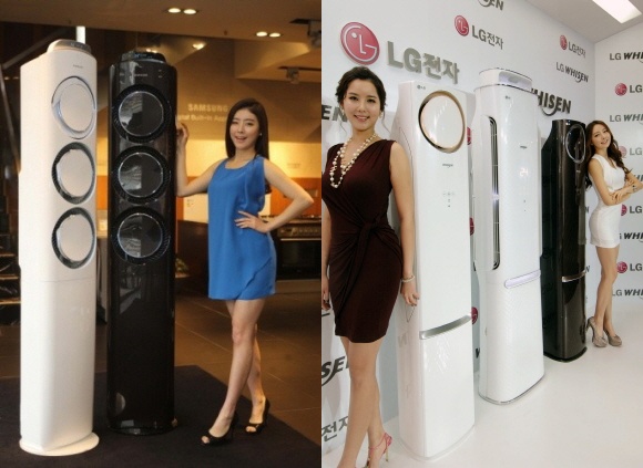 모델이 삼성 ´Q9000´(왼쪽)과 LG ´손연재스페셜 G´와 함께 포즈를 취하고 있다. ⓒ삼성/LG전자